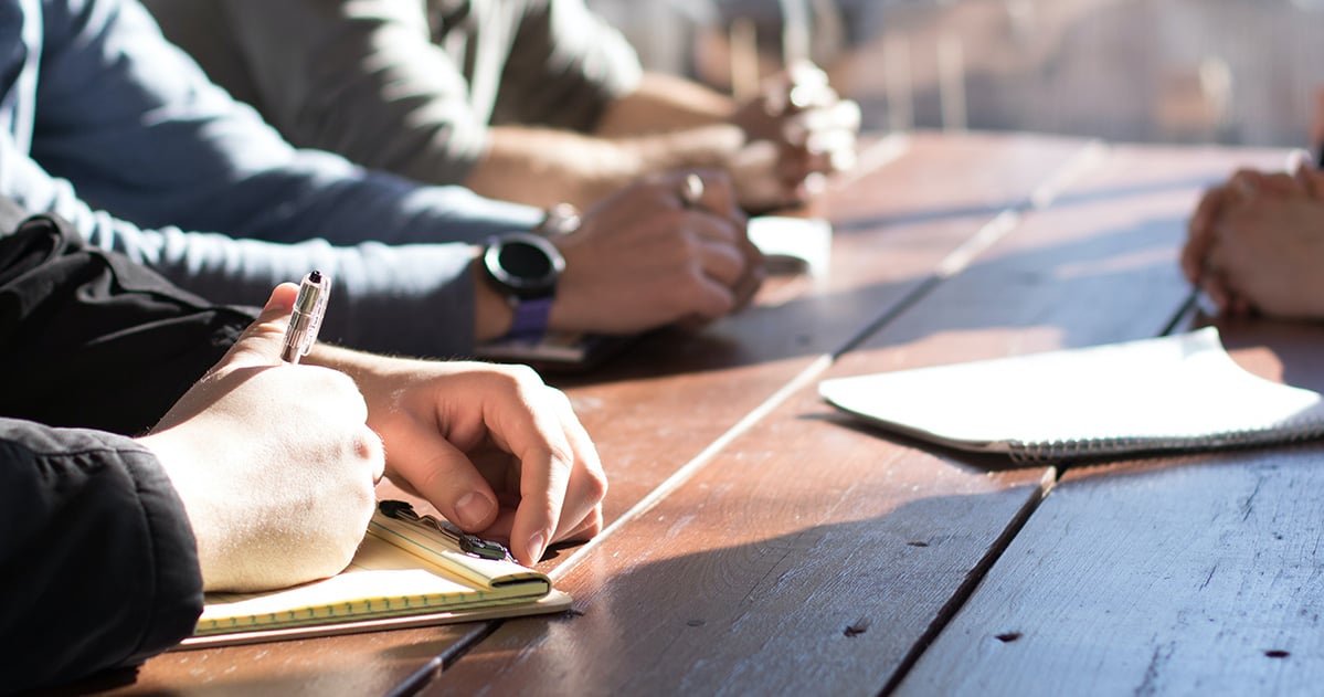 Close up of hands on a conference table