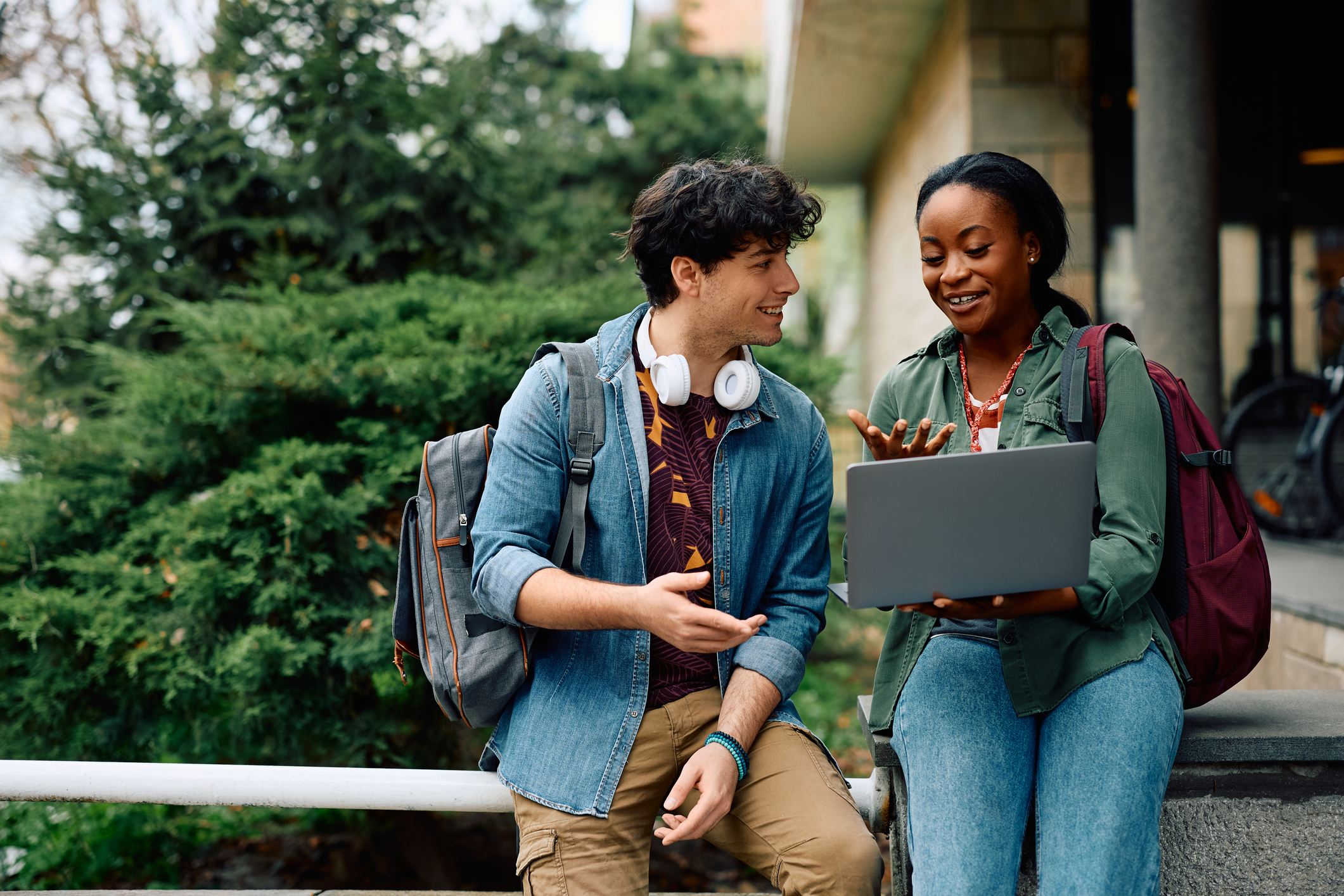 Two people looking at a laptop