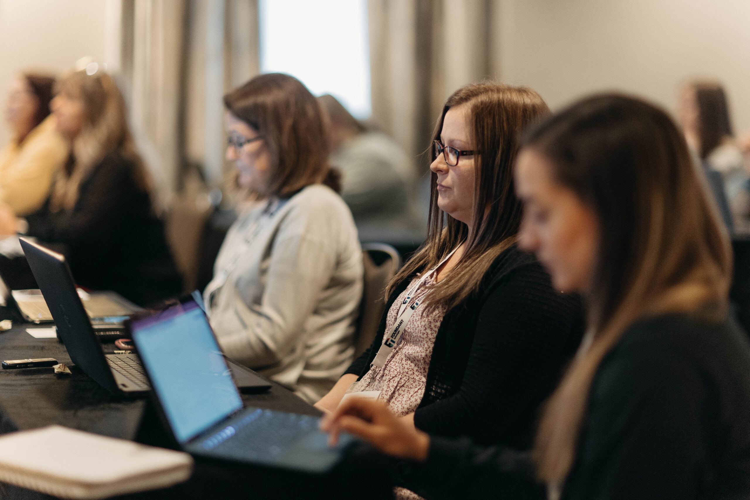 A group of people on computers