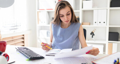 women looking at paper